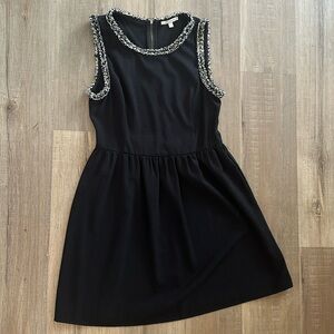 Black cocktail dress with fringe detailing